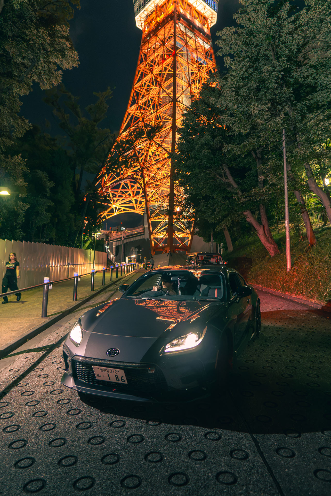 Toyota GR86 parked under Tokyo Tower at night